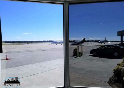 comparison before/after with 3M Night Vision 15 film installed at airport