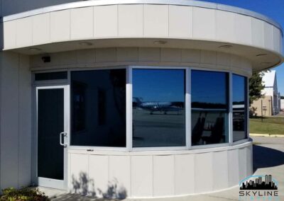 exterior view of airport office windows with 3M Night Vision 15 film installed