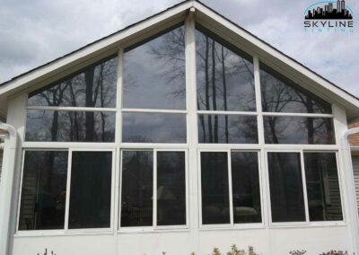 exterior view of sunroom with tinted windows
