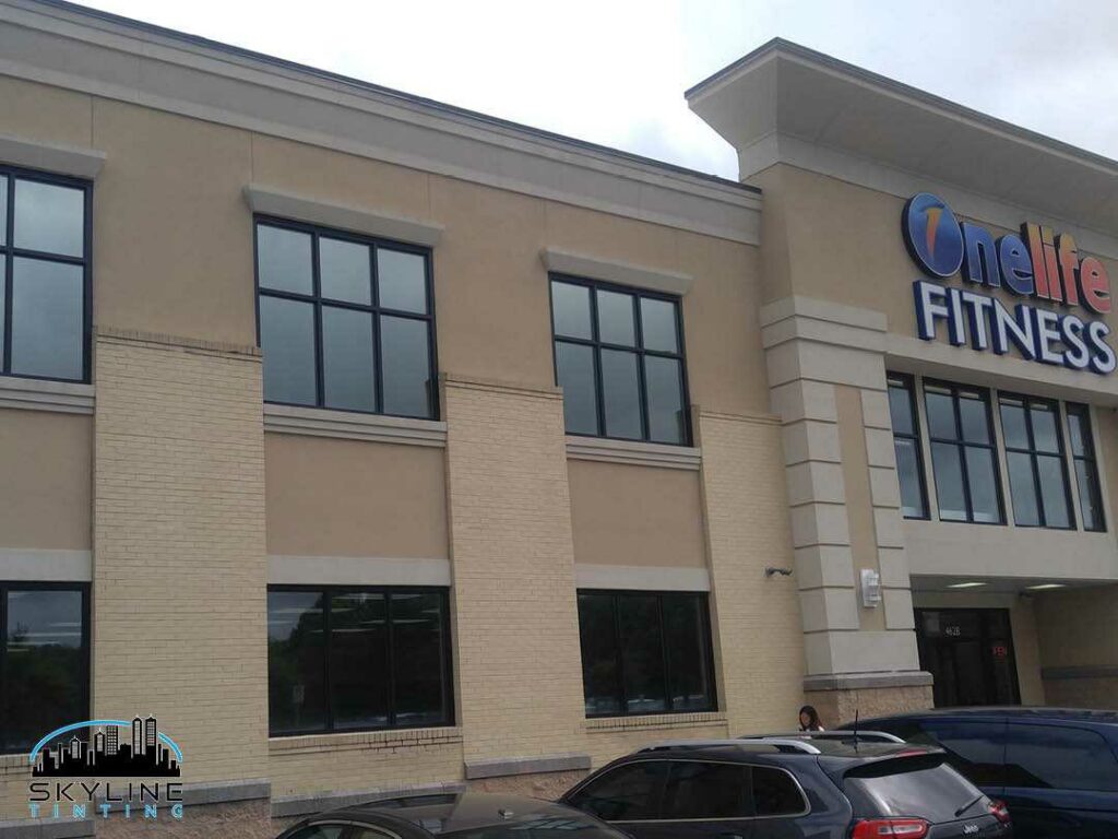 two story commercial building with solar tint installed on second floor