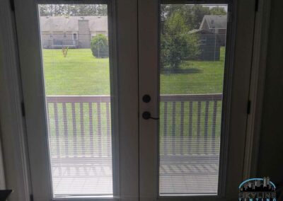 comparison with one patio door tinted while the other one is not