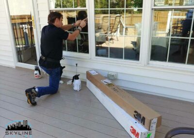 installer working on window with 3M Ultra S800 security film
