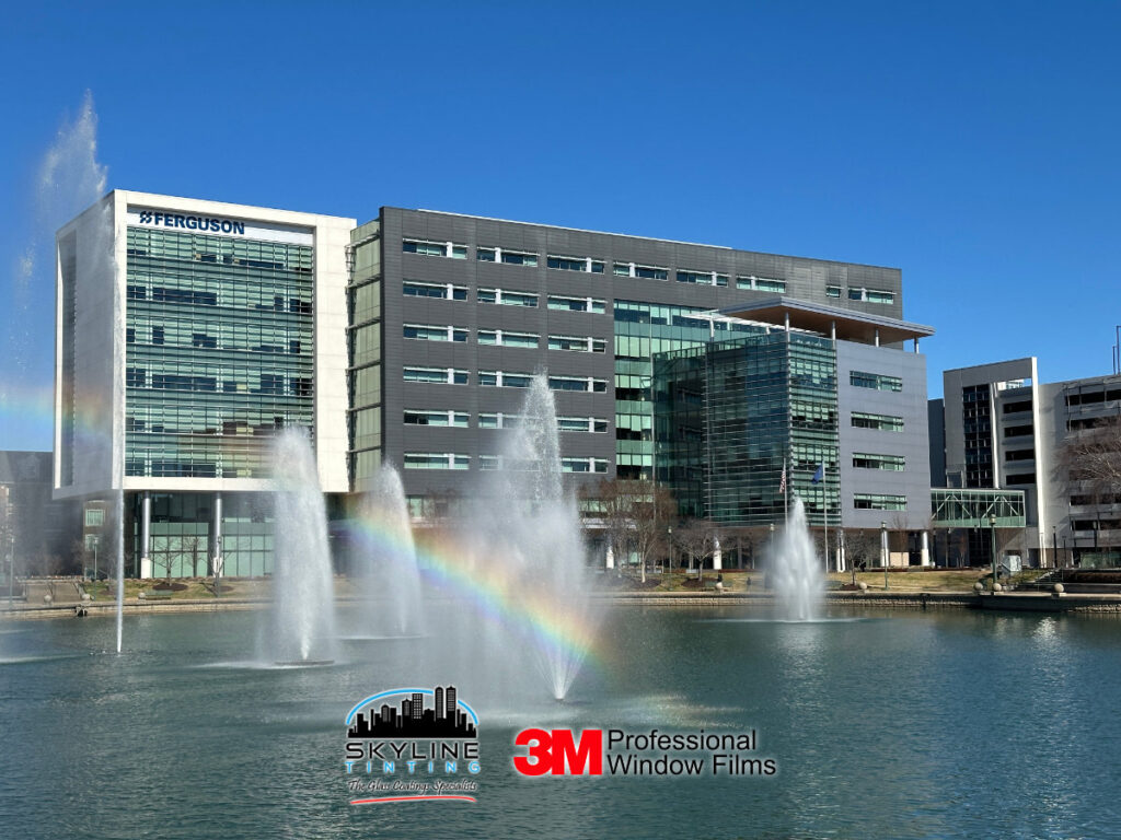 Modern 8-story office building with water fountain in front.