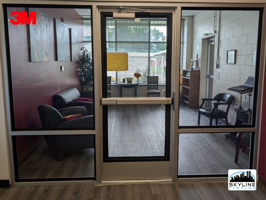 Clear 3M Ultra S800 security window film with Pentagon Protection frame attachment on the office foyer glass doors and windows at Perquimans County Schools in North Carolina